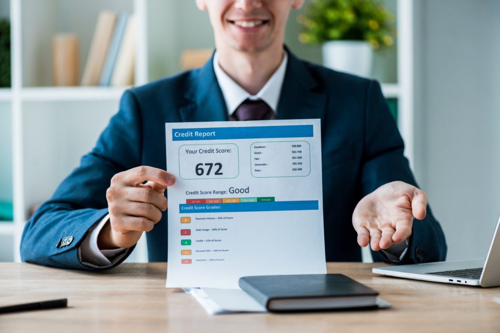 man showing credit score report